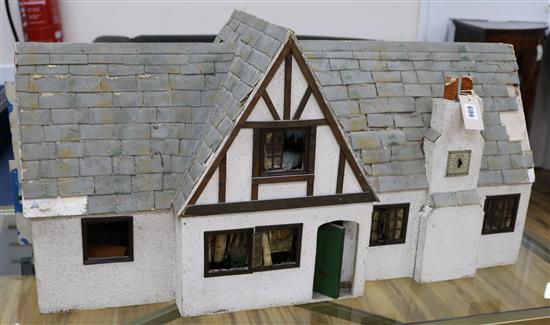 A 1930s dolls house and contents